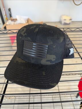 Branded Bills Black Camo Trucker Hat with American Flag Patch